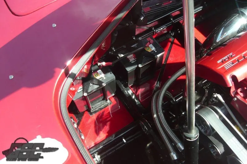 Slide: The Image of Red 2010 MTI 44 Corvette boat with sleek design and visible cockpit. - 34