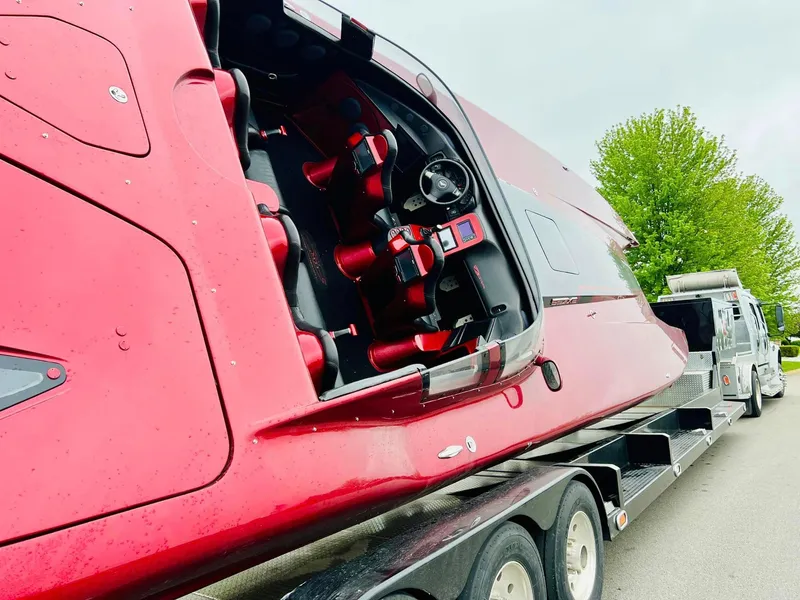 Slide: The Image of Red 2010 MTI 44 Corvette hood with engine view through transparent panel. - 36