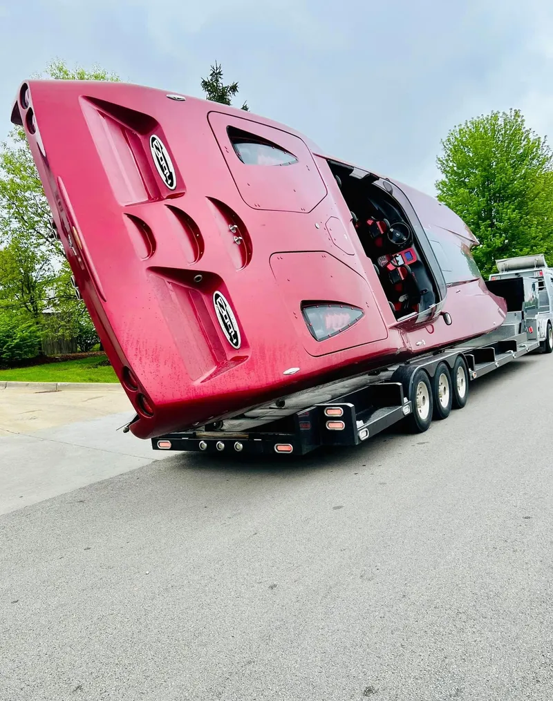 Slide: The Image of Red 2010 MTI 44 Corvette boat interior with sleek design and advanced controls. - 38