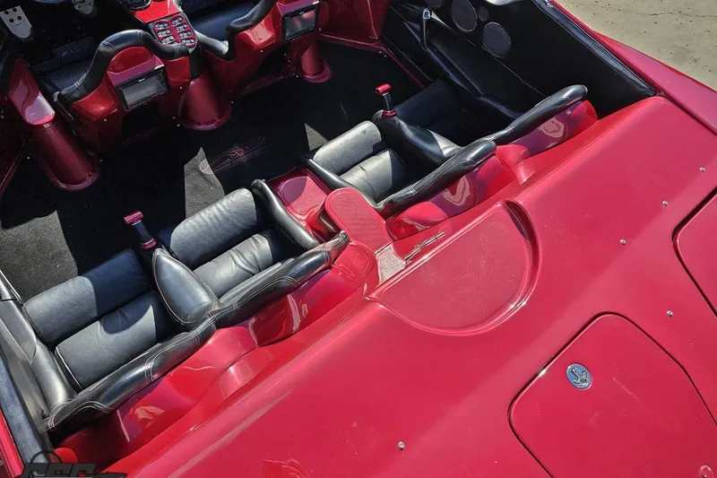 Slide: The Image of Red 2010 MTI 44 Corvette interior with black leather seats and detailed dashboard. - 44