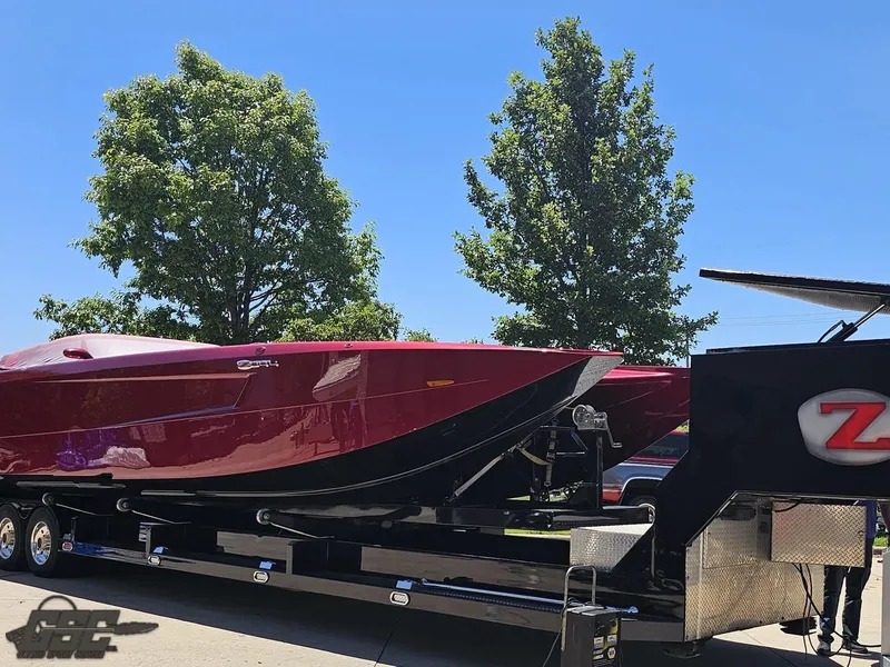 Slide: The Image of Red 2010 MTI 44 Corvette boat with black leather seats, aerial view. - 5
