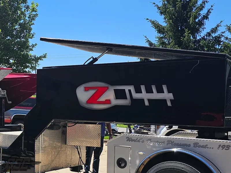 Slide: The Image of Red 2010 MTI 44 Corvette boat with sleek design and black seats. - 6