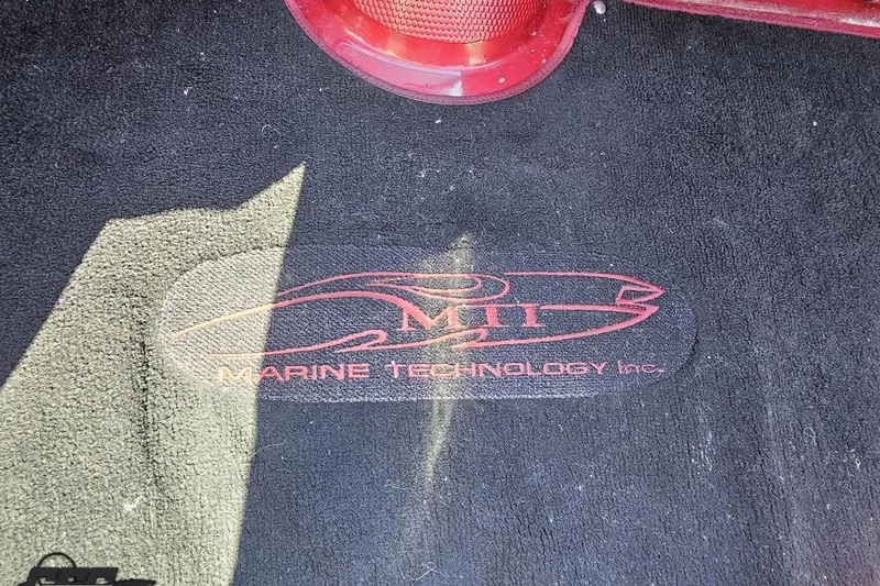 Slide: The Image of MTI Marine Technology Inc. logo on 2010 MTI 44 Corvette boat carpet. - 60