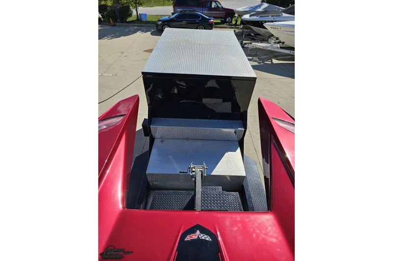 Slide: The Image of Red 2010 MTI 44 Corvette boat with sleek design and metallic accents. - 69