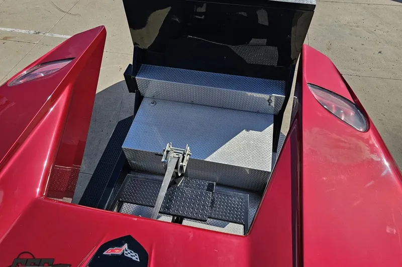 Slide: The Image of Red 2010 MTI 44 Corvette boat with open storage compartment, viewed from above. - 71