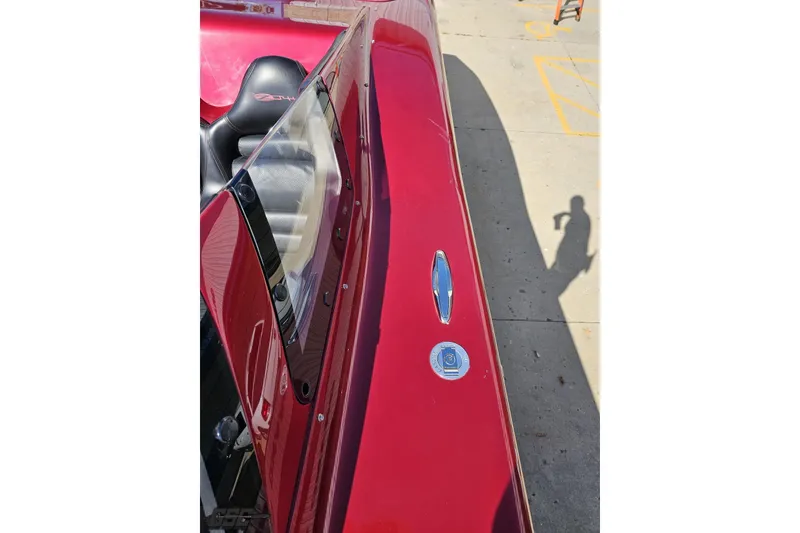 Slide: The Image of Red 2010 MTI 44 Corvette boat with sleek design and black seating. - 75