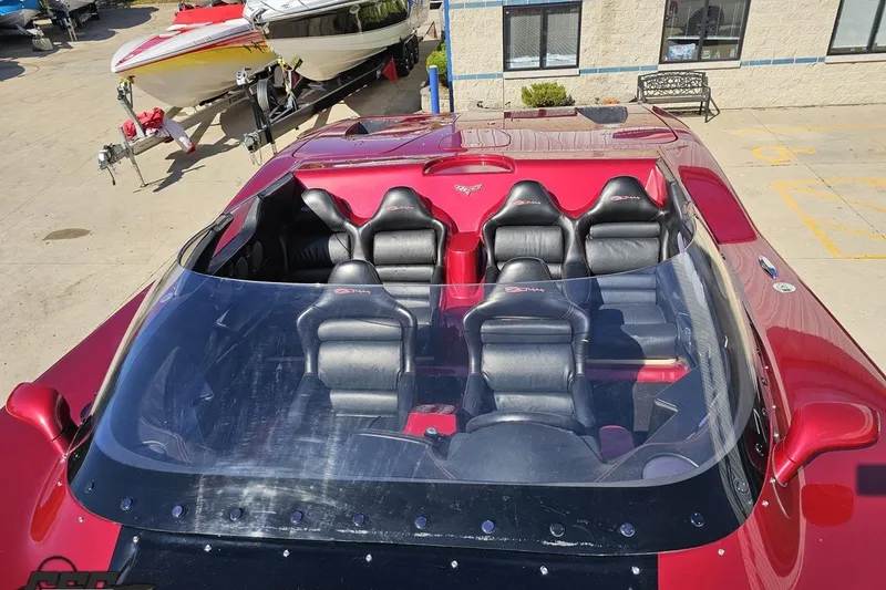 Slide: The Image of 2010 MTI 44 Corvette boat with sleek red design and luxurious seating. - 77