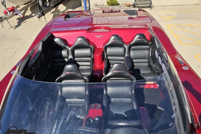 Slide: The Image of 2010 MTI 44 Corvette boat with sleek red and black interior design. - 78