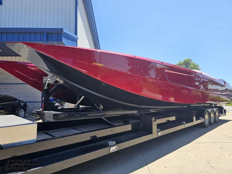 Slide: The Image of 2010 MTI 44 Corvette with Z44 logo, parked outdoors. - 8