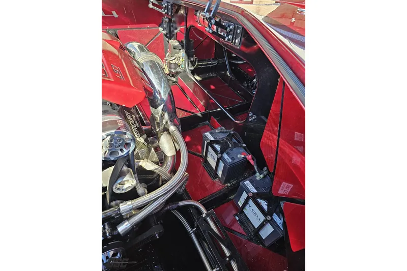 Slide: The Image of 2010 MTI 44 Corvette engine bay with red accents and visible components. - 91
