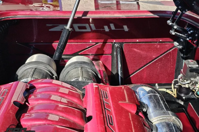 Slide: The Image of Engine bay of a 2010 MTI 44 Corvette with Z06 components, featuring red accents. - 93