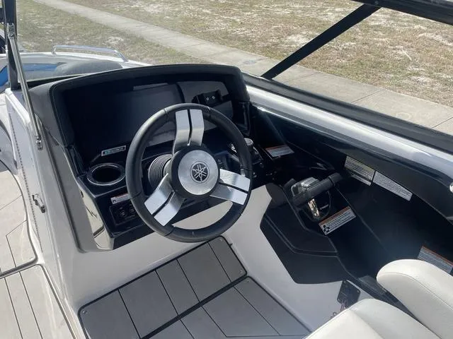 Slide: The Image of 2020 Yamaha Boats 242X steering console with modern controls and sleek design. - 10