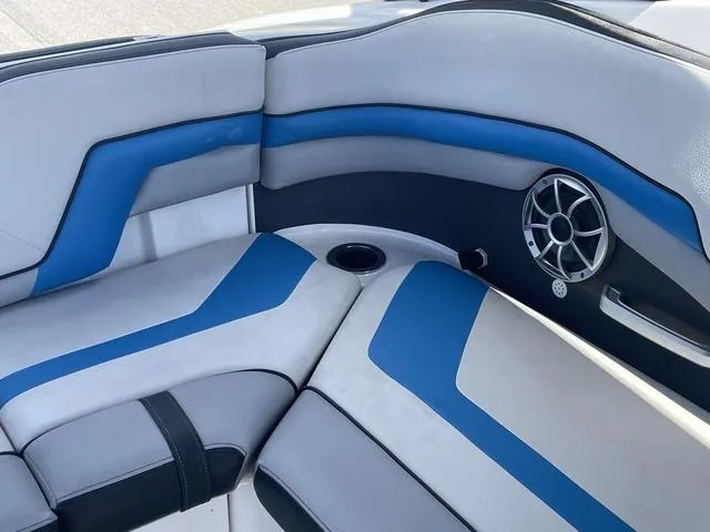 Slide: The Image of Interior seating of a 2020 Yamaha Boats 242X with blue and gray upholstery. - 16