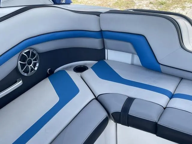 Slide: The Image of 2020 Yamaha Boats 242X interior seating with blue and gray upholstery. - 17