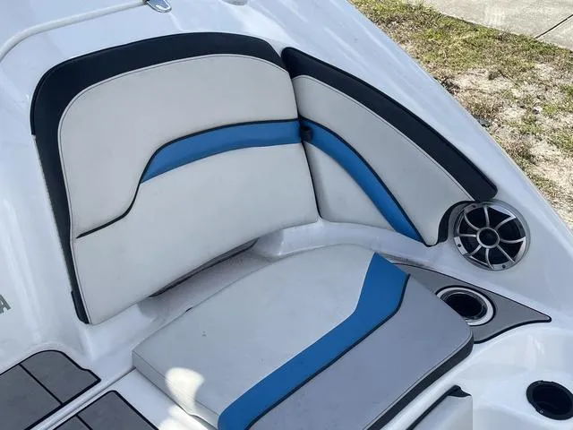 Slide: The Image of 2020 Yamaha Boats 242X interior seating with blue and black accents. - 22