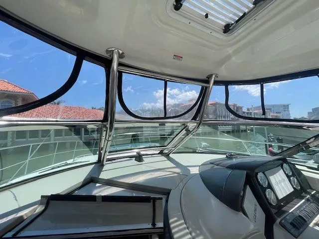 Slide: The Image of Interior view of 2005 Sea Ray 390 Sundancer yacht cockpit with panoramic windows. - 15