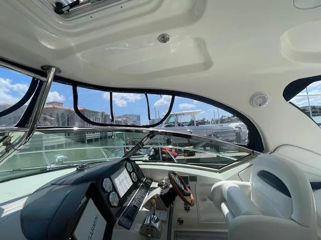 Slide: The Image of Interior cockpit view of 2005 Sea Ray 390 Sundancer yacht with modern controls. - 16