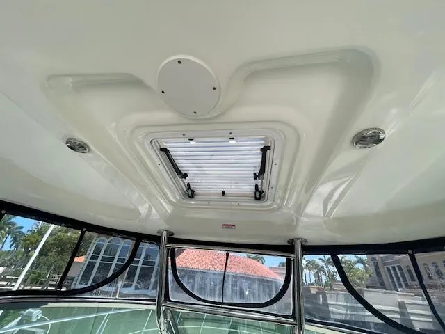 Slide: The Image of Interior view of 2005 Sea Ray 390 Sundancer boat with sunroof and windows. - 19