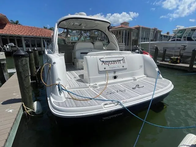 Slide: The Image of 2005 Sea Ray 390 Sundancer docked at marina, rear view. - 2
