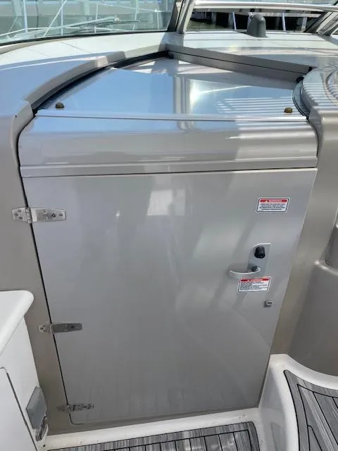 Slide: The Image of 2005 Sea Ray 390 Sundancer boat cabin door with stainless steel hinges and handle. - 31