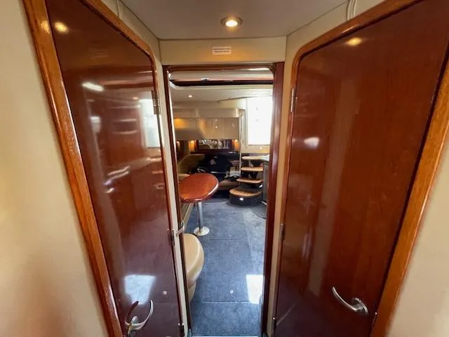 Slide: The Image of Interior of 2005 Sea Ray 390 Sundancer yacht with wooden doors and modern furnishings. - 45