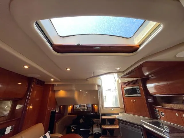 Slide: The Image of Interior of 2005 Sea Ray 390 Sundancer yacht with skylight and modern amenities. - 46