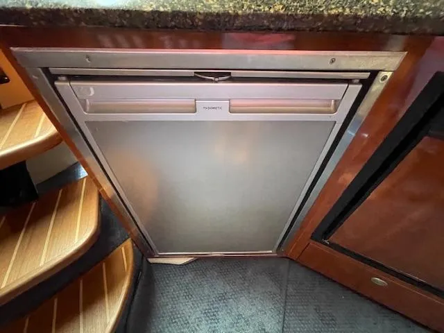 Slide: The Image of Compact refrigerator in the 2005 Sea Ray 390 Sundancer yacht kitchen. - 47