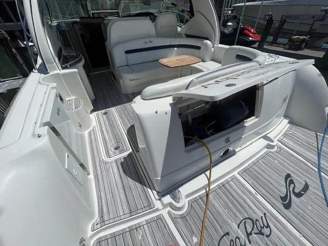 Slide: The Image of 2005 Sea Ray 390 Sundancer yacht interior with seating and storage. - 5