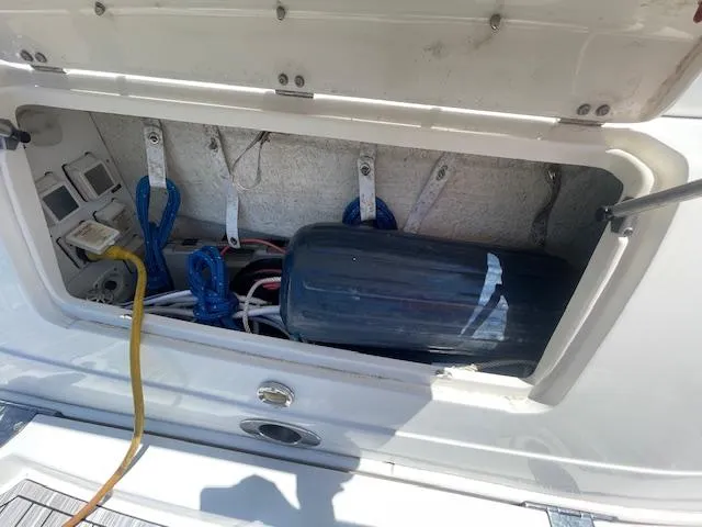 Slide: The Image of Storage compartment of a 2005 Sea Ray 390 Sundancer boat with cables and equipment. - 7