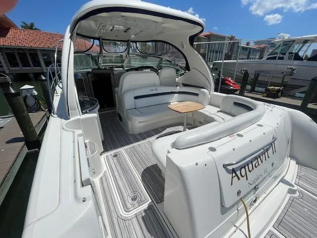 Slide: The Image of 2005 Sea Ray 390 Sundancer yacht with spacious seating and table on deck. - 9