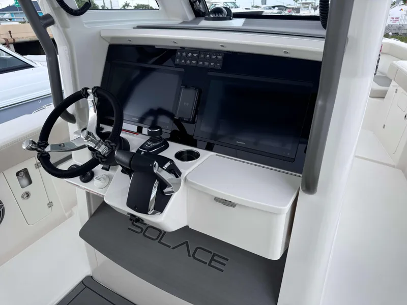 Slide: The Image of Helm station of 2024 Solace 32 CS boat with modern controls and displays. - 15