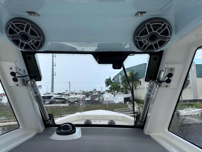 Slide: The Image of Interior view of 2024 Solace 32 CS boat with speakers and compass. - 16