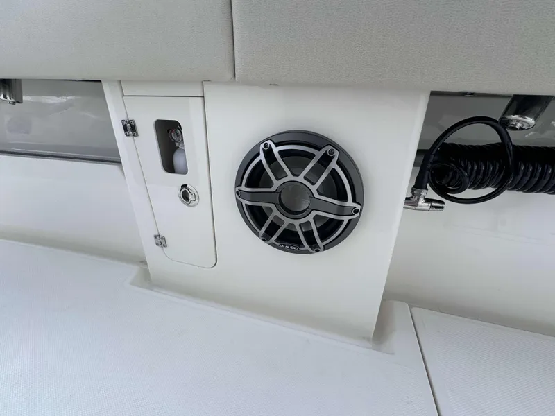 Slide: The Image of 2024 Solace 32 CS boat interior with speaker and storage compartment. - 17