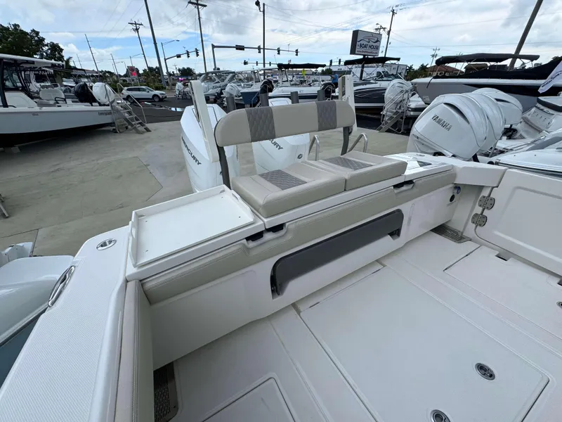 Slide: The Image of 2024 Solace 32 CS boat interior with seating and storage compartments. - 19