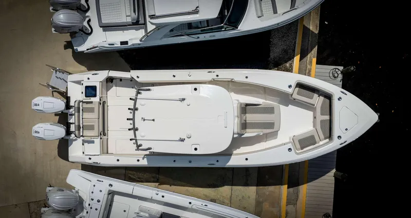 Slide: The Image of Aerial view of a 2024 Solace 32 CS boat docked. - 2