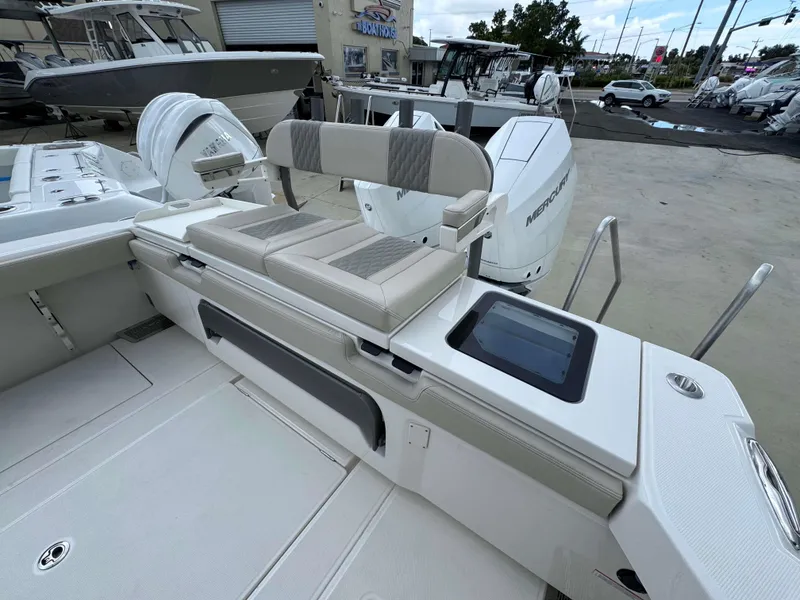 Slide: The Image of 2024 Solace 32 CS boat with seating and Mercury outboard engines. - 20