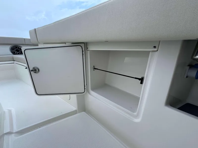 Slide: The Image of Open storage compartment on 2024 Solace 32 CS boat. - 32