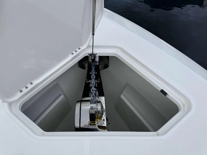 Slide: The Image of Anchor compartment of 2024 Solace 32 CS boat with open hatch. - 6