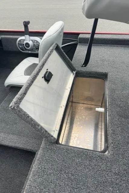 Slide: The Image of 2024 Crestliner 1600 Storm boat with open storage compartment. - 12