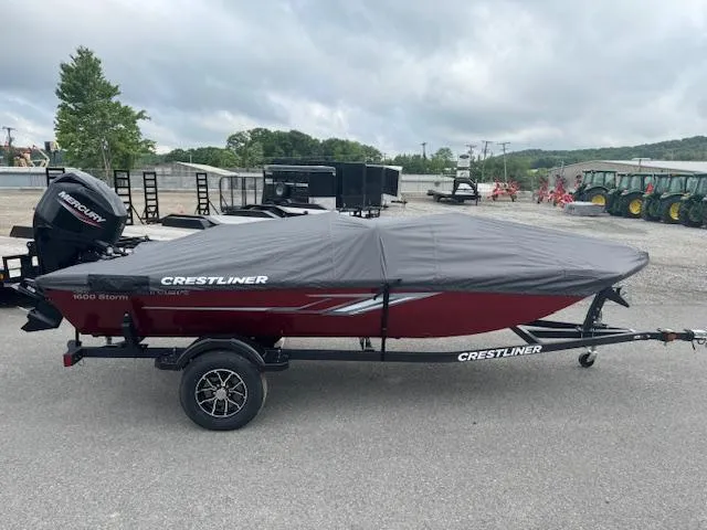 Slide: The Image of 2024 Crestliner 1600 Storm boat with cover on trailer. - 16