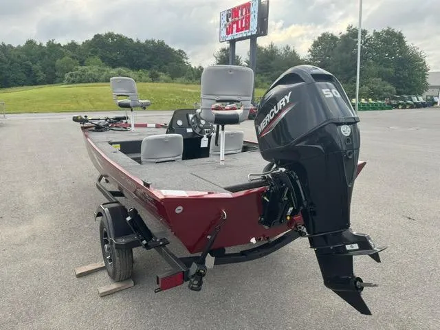 Slide: The Image of 2024 Crestliner 1600 Storm boat with Mercury 50 outboard motor in parking lot. - 4