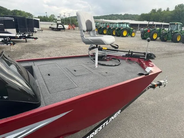 Slide: The Image of 2024 Crestliner 1600 Storm fishing boat with elevated seat and storage compartments. - 6