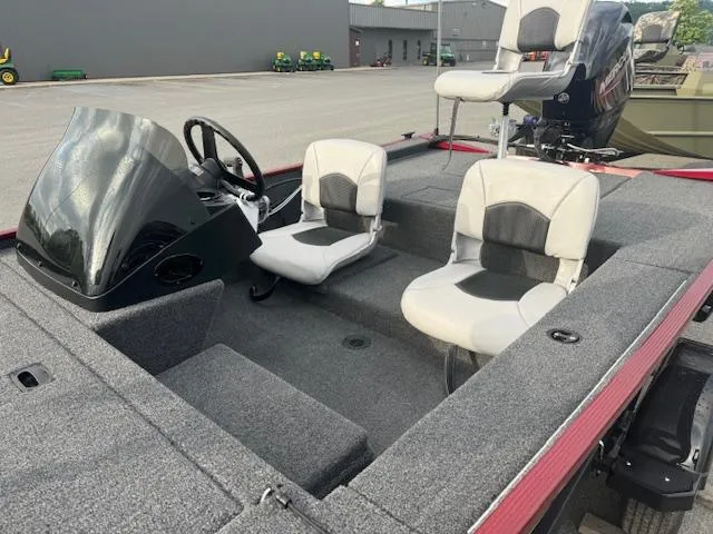 Slide: The Image of 2024 Crestliner 1600 Storm fishing boat interior with seating and console. - 8