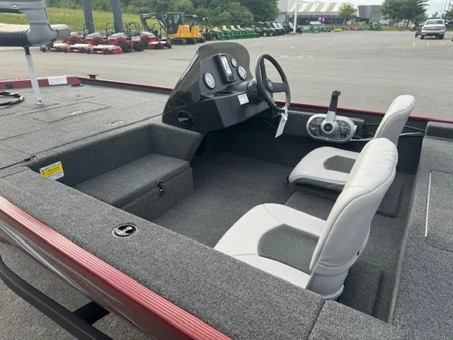 Slide: The Image of 2024 Crestliner 1600 Storm boat interior with steering console and seating. - 9