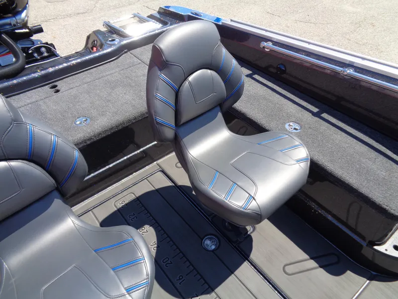 Slide: The Image of 2024 Nitro ZV21 boat interior with gray and blue seats. - 11