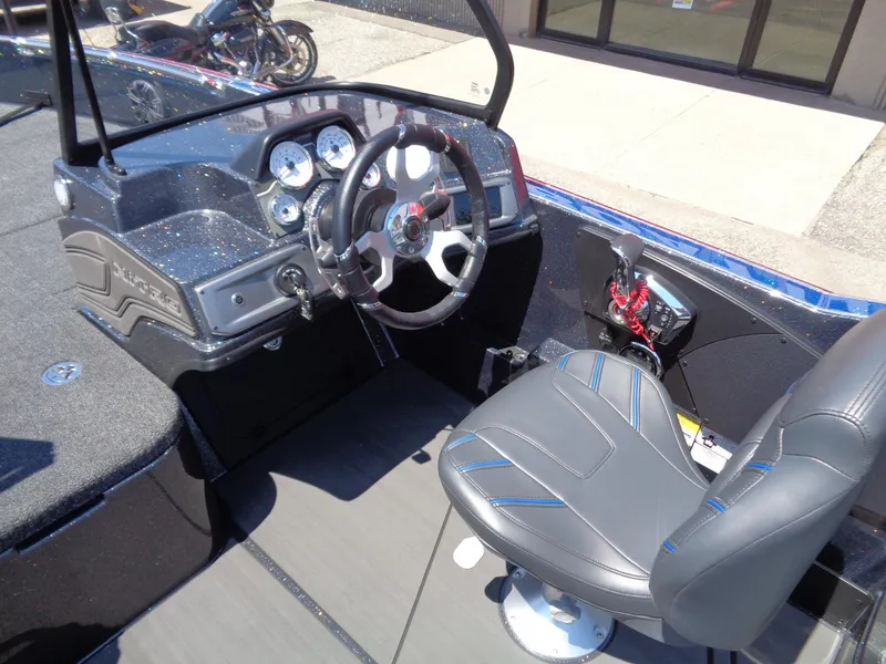 Slide: The Image of 2024 Nitro ZV21 boat cockpit with steering wheel and control panel. - 13