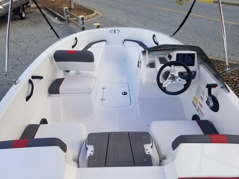 Slide: The Image of 2024 Tahoe 210 S boat interior with modern dashboard and seating. - 3