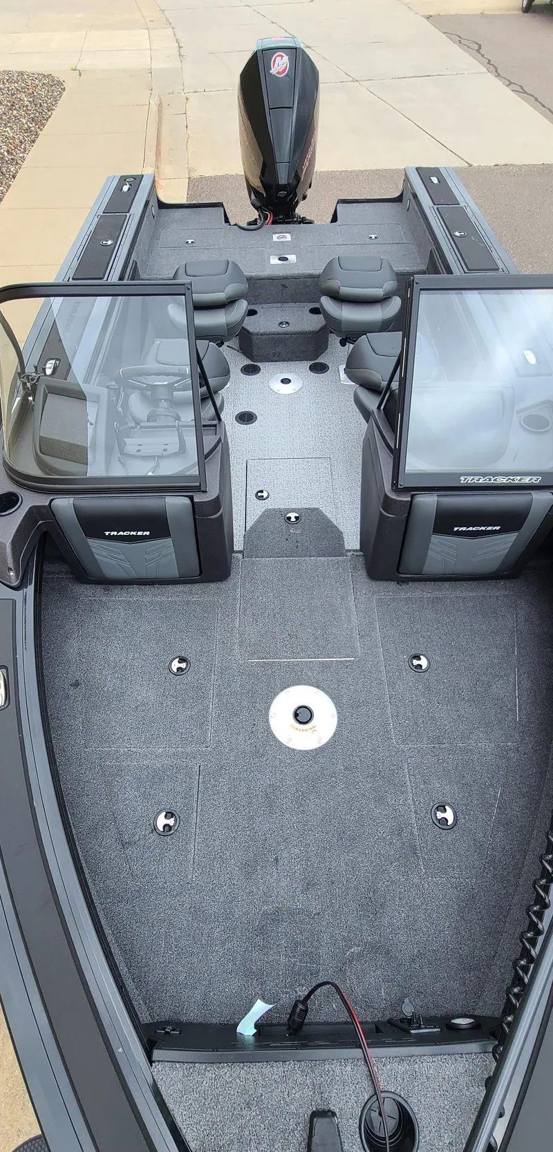 Slide: The Image of 2024 Tracker Targa V-19 WT boat interior with dual consoles and spacious deck. - 4