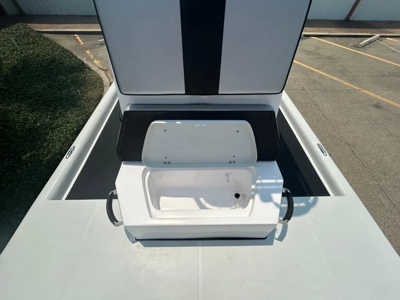 Slide: The Image of 2025 Shallow Stalker 240 RC Elite boat with open storage compartment. - 14