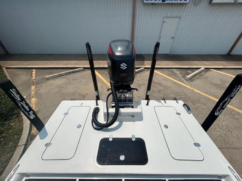 Slide: The Image of Top view of 2025 Shallow Stalker 240 RC Elite boat with Suzuki outboard motor. - 15